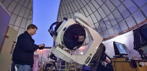 Adam Block adjusting the Schulmann Telescope at the Mt. Lemmon SkyCenter, with which he found the supernova. (Photo: Dave Harvey) Adam Block adjusting the Schulmann Telescope at the Mt. Lemmon SkyCenter, with which he found the supernova. (Photo: Dave Harvey)